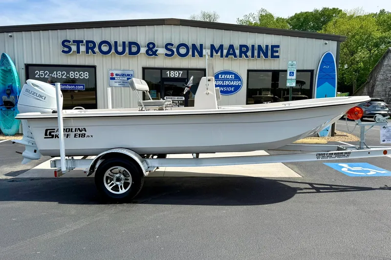 Slide: The Image of 2025 Carolina Skiff E18 JVX CC boat on trailer at Stroud & Son Marine dealership. - 35