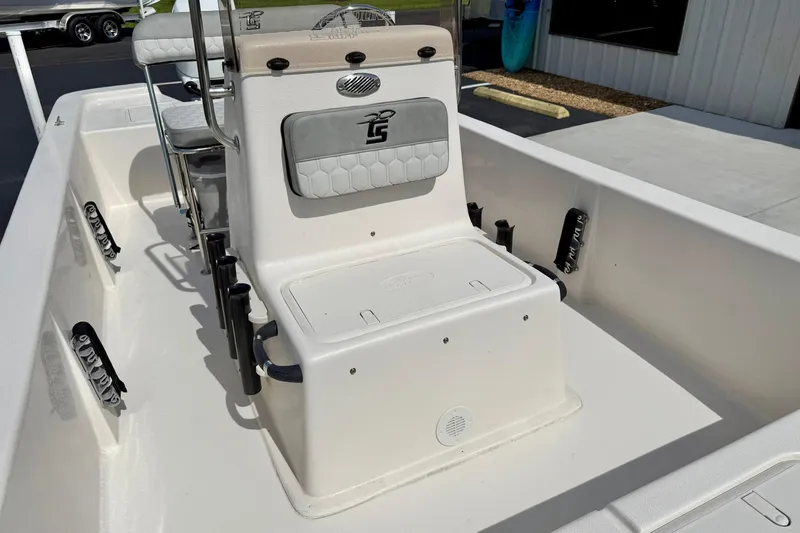 Slide: The Image of 2025 Carolina Skiff E18 JVX CC boat interior with seating and storage compartments. - 40