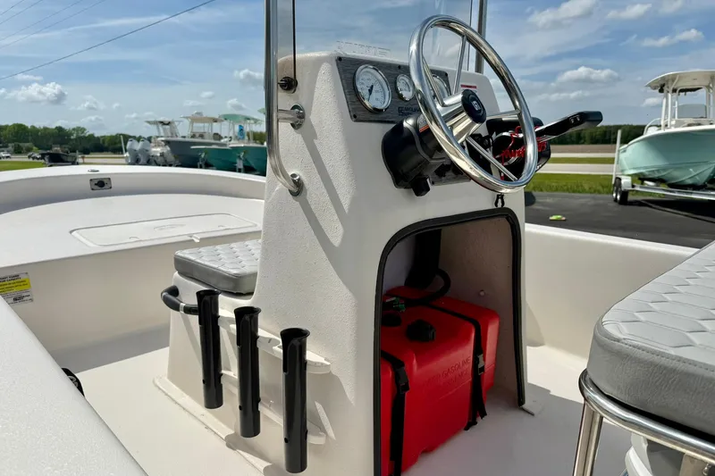 Slide: The Image of 2025 Carolina Skiff E18 JVX CC boat console with steering wheel and gauges. - 43
