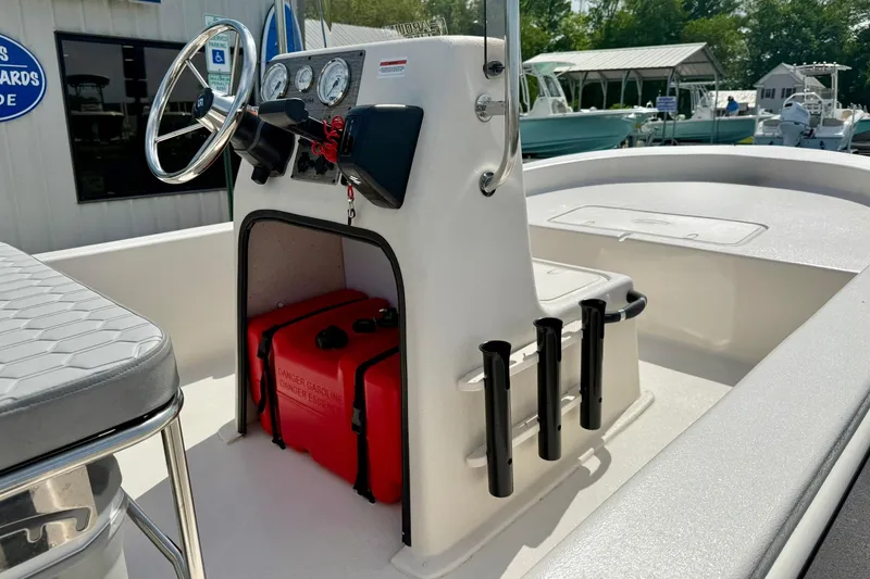 Slide: The Image of 2025 Carolina Skiff E18 JVX CC boat interior with steering console and storage area. - 44