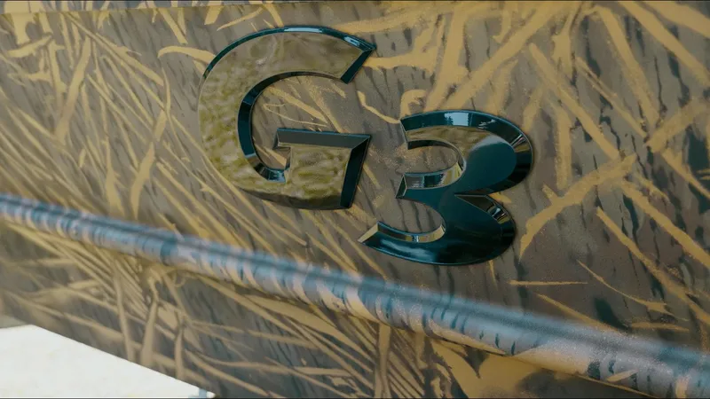 Slide: The Image of 2025 G3 Gator Tough 16 DK boat with camouflage design and logo. - 17