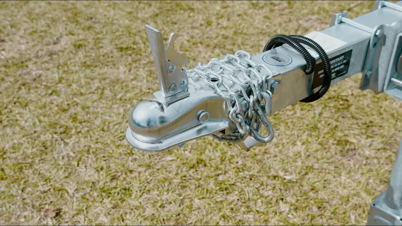 Slide: The Image of Trailer hitch of 2025 G3 Gator Tough 16 DK on grass background. - 19