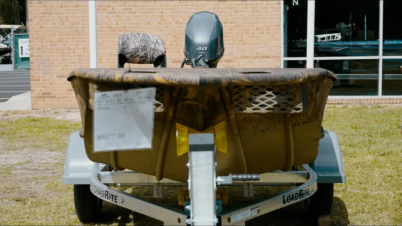 Slide: The Image of 2025 G3 Gator Tough 16 DK boat on trailer, displayed outdoors. - 21