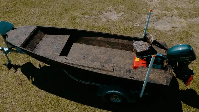 Slide: The Image of 2025 G3 Gator Tough 16 DK boat on grass, featuring a Yamaha motor. - 3