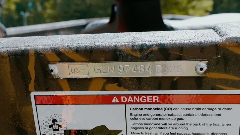 Slide: The Image of 2025 G3 Gator Tough 16 DK boat with warning label and serial number plate. - 8