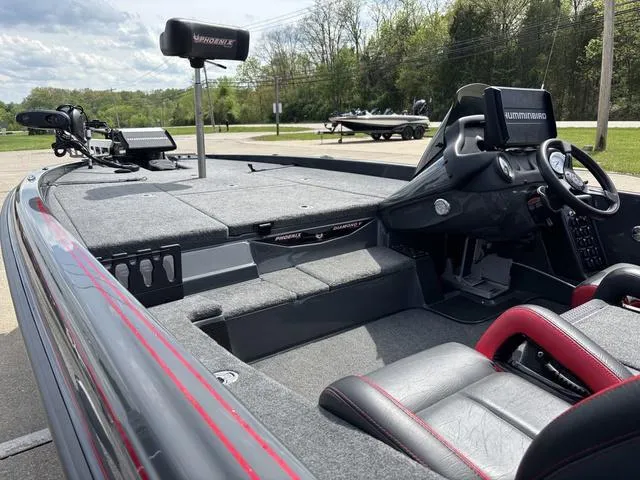 Slide: The Image of 2023 Phoenix 920 Elite II boat interior with advanced navigation system and seating. - 14