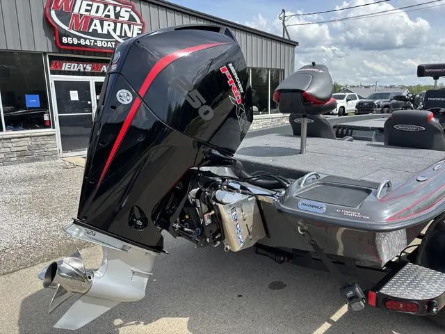 Slide: The Image of 2023 Phoenix 920 Elite II boat with powerful engine at Mieda's Marine dealership. - 2