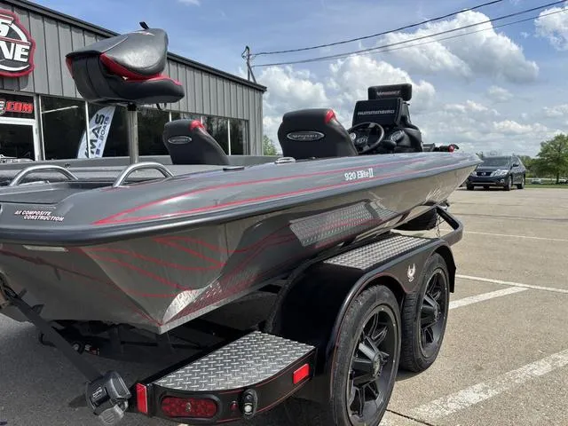 Slide: The Image of 2023 Phoenix 920 Elite II boat on trailer, parked outdoors near a building. - 3
