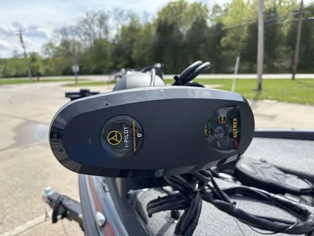 Slide: The Image of 2023 Phoenix 920 Elite II boat with i-Pilot Ultrex trolling motor in a parking lot. - 9