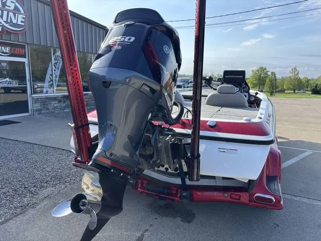 Slide: The Image of 2011 Skeeter FX21 boat with Yamaha 250 engine, parked outdoors. - 2