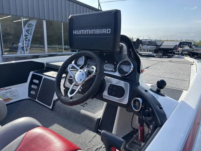 Slide: The Image of 2011 Skeeter FX21 boat dashboard with Humminbird electronics and steering wheel. - 5