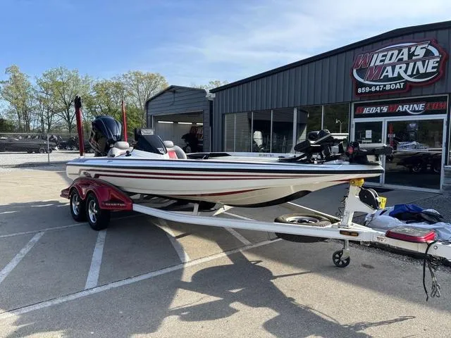 Slide: The Image of 2011 Skeeter FX21 boat on trailer at dealership, sunny day. - 7