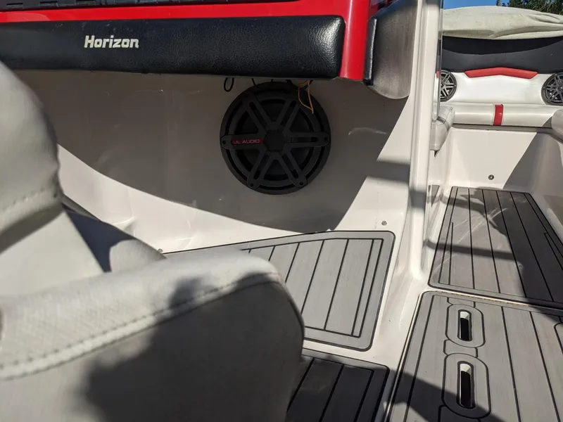 Slide: The Image of Interior of 2014 Four Winns H230SS boat with speaker and seating area. - 9