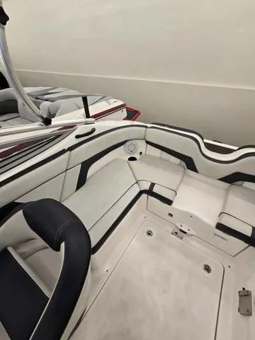 Slide: The Image of 2015 Yamaha AR210 boat interior with sleek seating and modern design. - 6