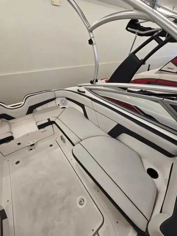 Slide: The Image of 2015 Yamaha AR210 boat interior with sleek seating and modern design. - 7