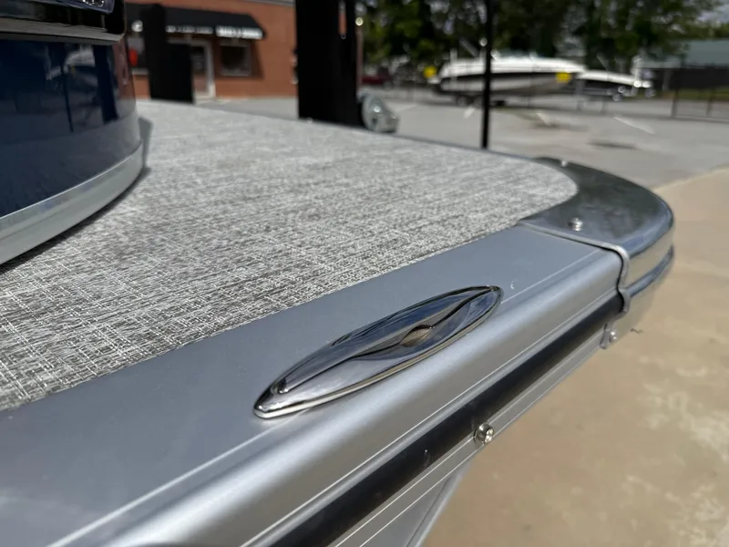Slide: The Image of 2025 Avalon LSZ Quad Lounger Shift pontoon boat, close-up of sleek deck design. - 13