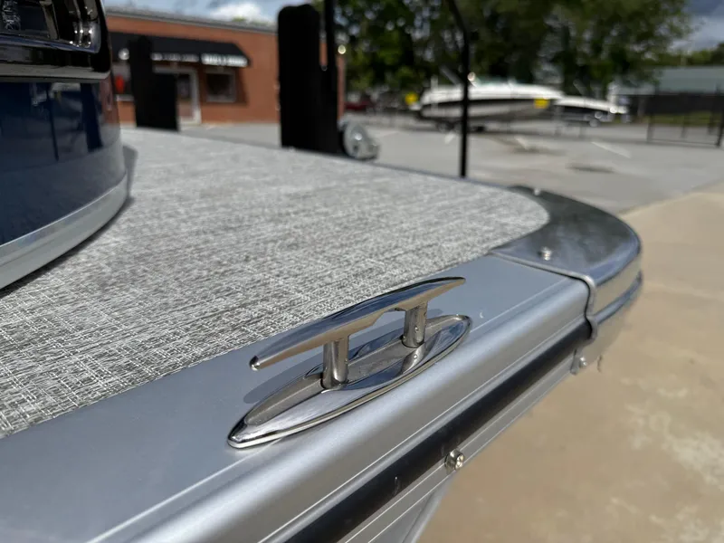 Slide: The Image of 2025 Avalon LSZ Quad Lounger Shift boat detail with cleat and textured deck. - 14