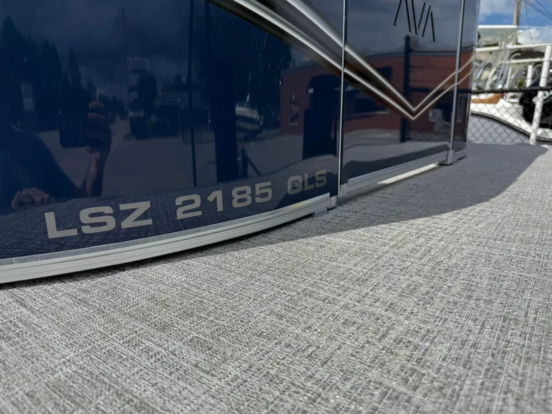Slide: The Image of 2025 Avalon LSZ QUAD LOUNGER SHIFT boat exterior with LSZ 2185 GLS branding. - 15