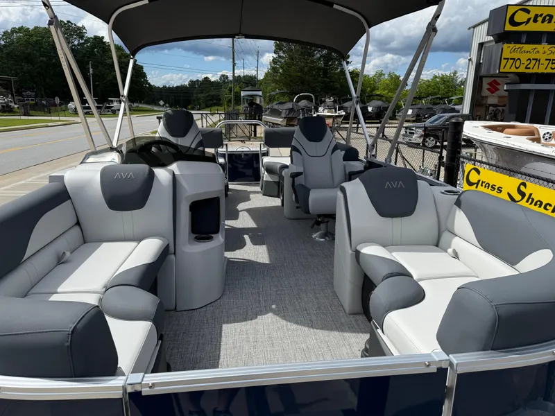 Slide: The Image of 2025 Avalon LSZ Quad Lounger Shift pontoon boat with spacious seating and canopy. - 16