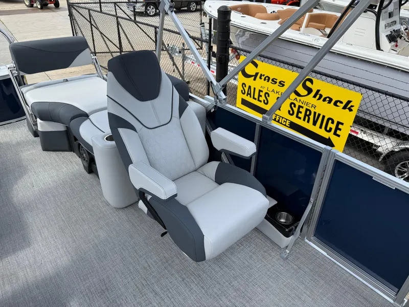 Slide: The Image of 2025 Avalon LSZ Quad Lounger Shift boat interior with plush seating and sales signage. - 20
