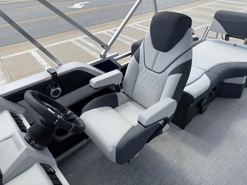 Slide: The Image of 2025 Avalon LSZ Quad Lounger Shift boat interior with luxurious seating and modern steering console. - 21