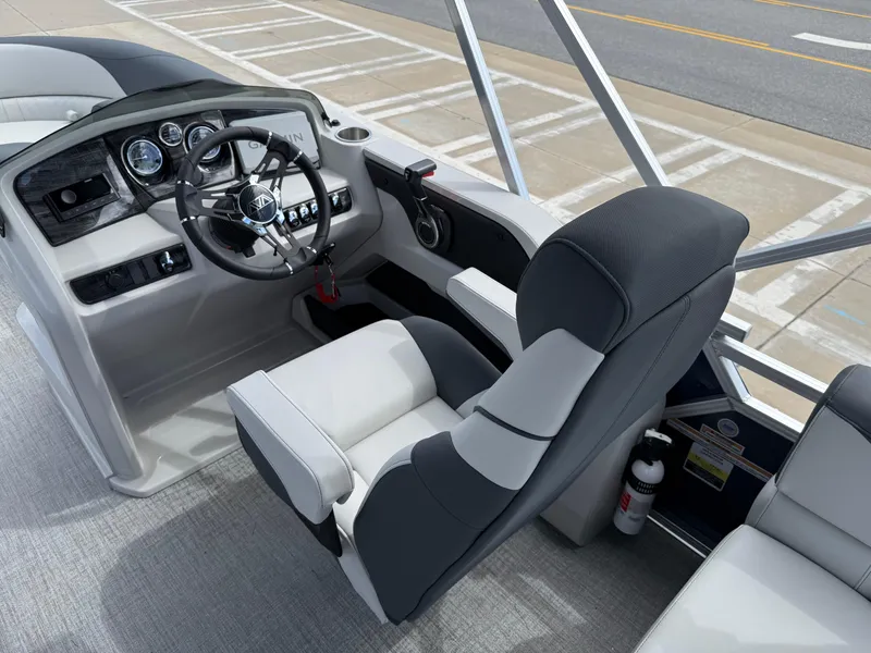 Slide: The Image of 2025 Avalon LSZ Quad Lounger Shift boat interior with modern steering and comfortable seating. - 23