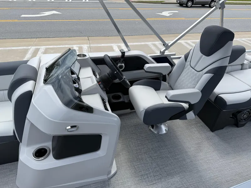 Slide: The Image of Luxurious 2025 Avalon LSZ Quad Lounger Shift boat interior with modern helm and seating. - 24