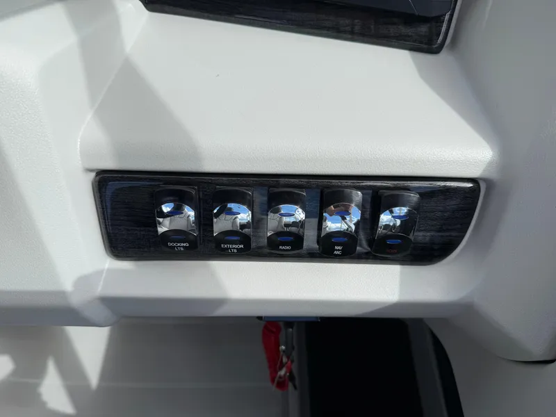 Slide: The Image of Control panel of 2025 Avalon LSZ Quad Lounger Shift with labeled switches. - 29