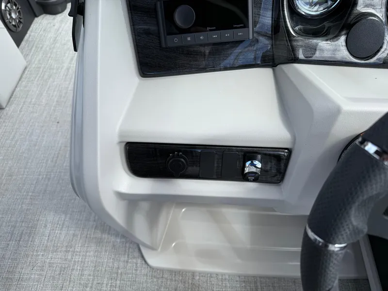 Slide: The Image of Control panel of 2025 Avalon LSZ Quad Lounger Shift boat, featuring sleek design and modern controls. - 30