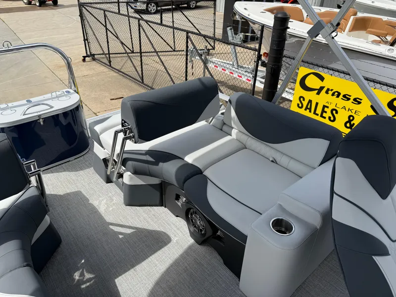 Slide: The Image of 2025 Avalon LSZ Quad Lounger Shift boat interior with gray seating and cup holders. - 34