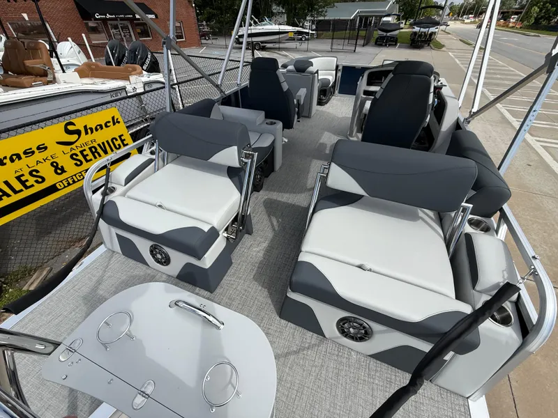 Slide: The Image of 2025 Avalon LSZ Quad Lounger Shift boat interior with gray seating and modern design. - 40