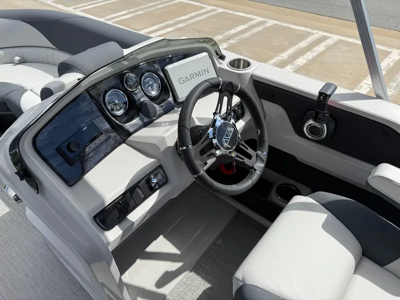 Slide: The Image of 2025 Avalon LSZ Quad Lounger Shift boat dashboard with Garmin navigation system. - 48
