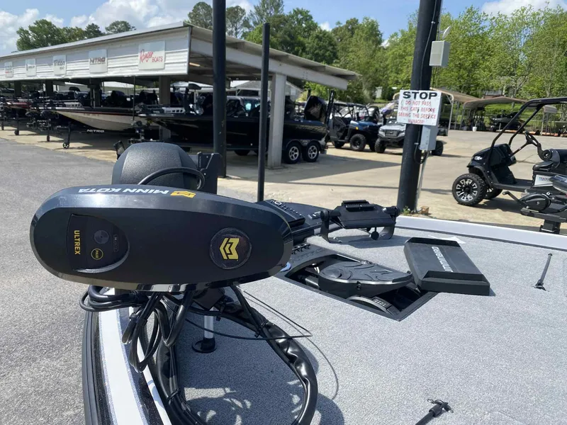 Slide: The Image of 2024 Nitro Z20 Pro boat with Minn Kota trolling motor at a dealership. - 3