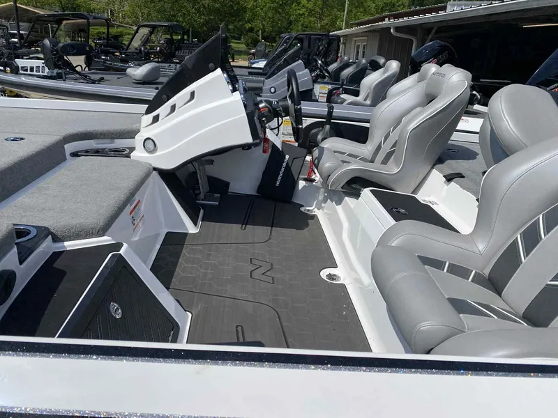 Slide: The Image of 2024 Nitro Z20 Pro boat interior with gray seating and modern dashboard. - 5