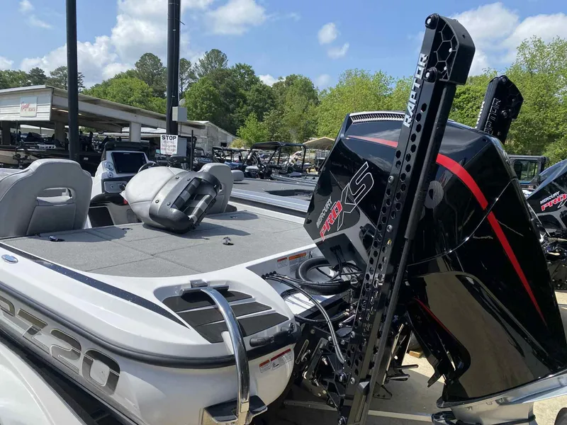 Slide: The Image of 2024 Nitro Z20 Pro boat with powerful engine, parked outdoors under clear sky. - 6