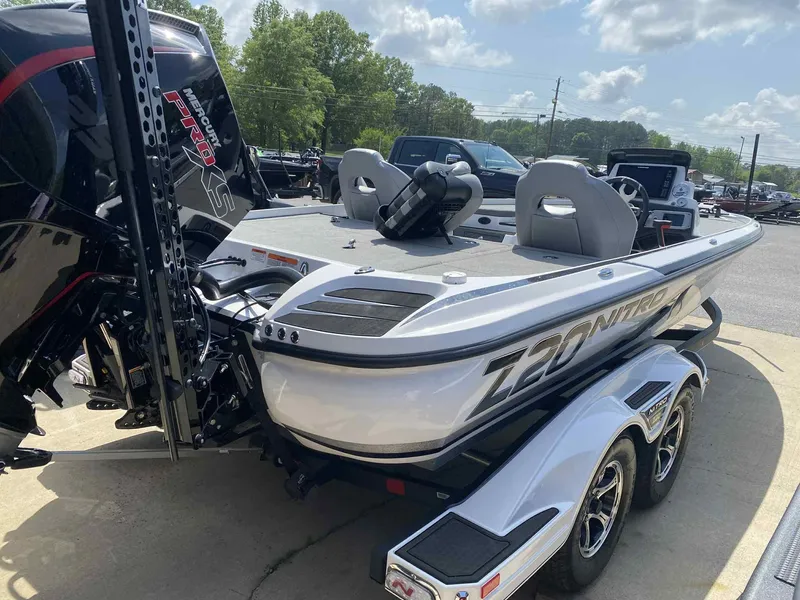 Slide: The Image of 2024 Nitro Z20 Pro boat with dual seats and powerful engine, parked outdoors. - 7