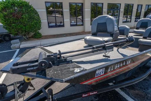 Slide: The Image of 2021 Tracker BASS TRACKER® Classic XL boat with Minn Kota trolling motor, parked outdoors. - 11
