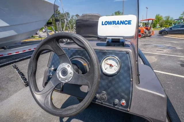 Slide: The Image of 2021 Tracker BASS TRACKER® Classic XL dashboard with steering wheel and Lowrance display. - 14