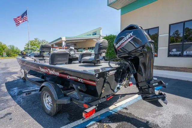 Slide: The Image of 2021 Tracker BASS TRACKER® Classic XL boat with Mercury engine, parked outdoors. - 3