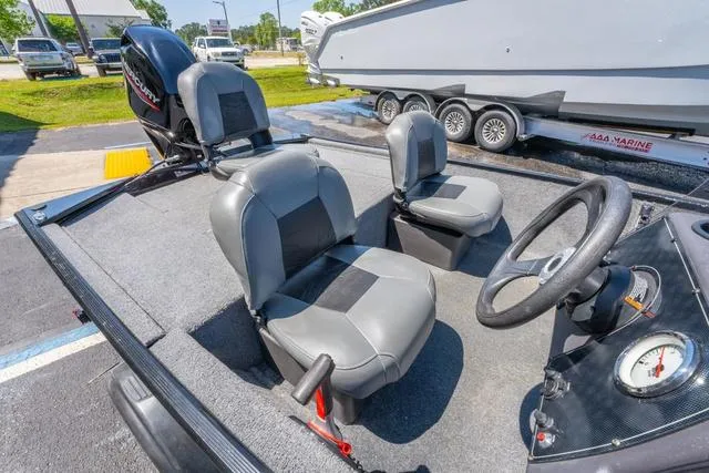 Slide: The Image of 2021 Tracker BASS TRACKER® Classic XL boat interior with seating and steering wheel. - 8