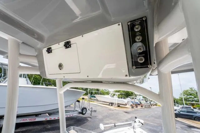 Slide: The Image of 2023 Sea Pro 228 Bay boat console with storage and control panel. - 15