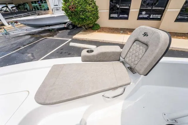 Slide: The Image of 2023 Sea Pro 228 Bay boat seat with armrest and diamond-patterned upholstery. - 22