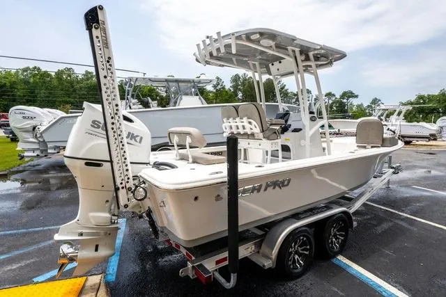Slide: The Image of 2023 Sea Pro 228 Bay boat with Suzuki outboard engine on a trailer. - 5