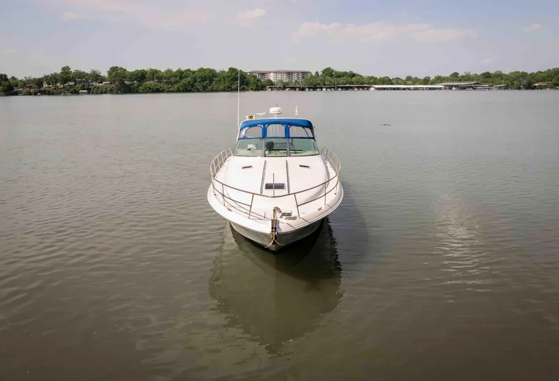 Slide: The Image of 1998 Sea Ray Sundancer 400 yacht on calm water, front view. - 12