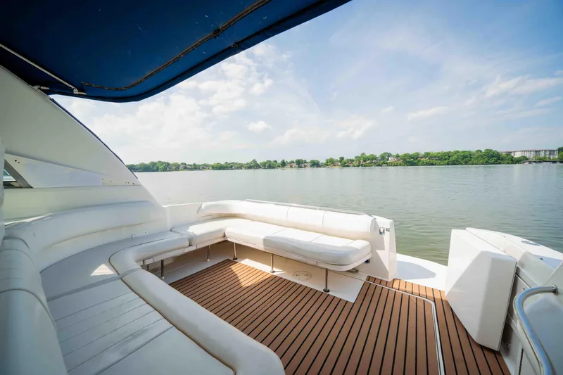 Slide: The Image of Spacious deck of 1998 Sea Ray Sundancer 400 yacht with scenic lake view. - 18