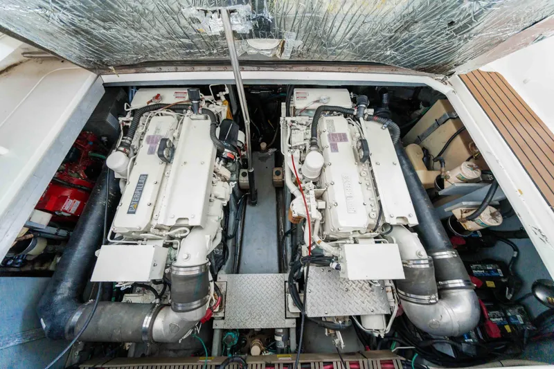 Slide: The Image of Engine room of 1998 Sea Ray Sundancer 400 with dual engines and mechanical components. - 29