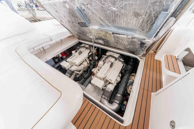 Slide: The Image of Engine compartment of 1998 Sea Ray Sundancer 400 yacht, showcasing dual engines. - 30
