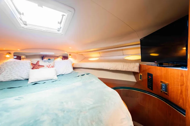 Slide: The Image of Luxurious cabin interior of 1998 Sea Ray Sundancer 400 yacht with cozy bedding and TV. - 34