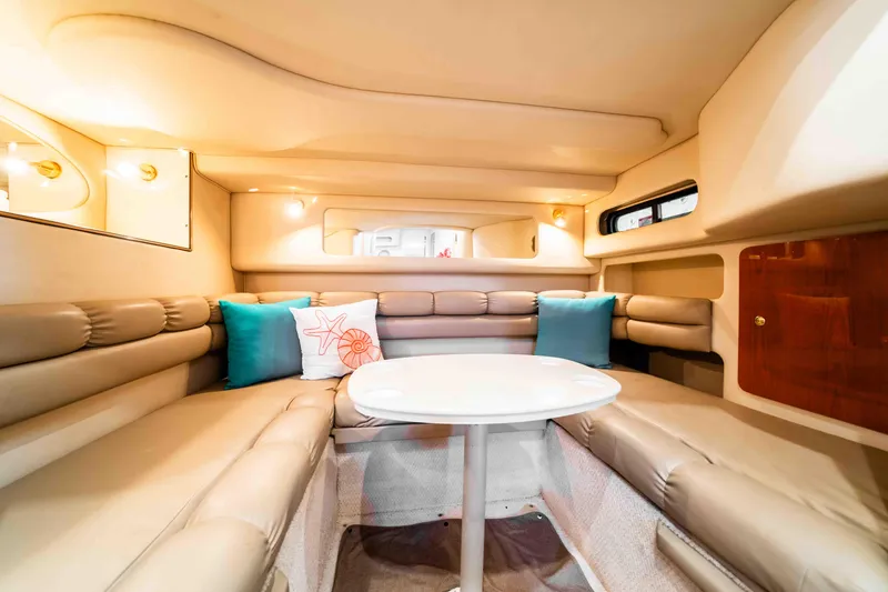Slide: The Image of Interior of 1998 Sea Ray Sundancer 400 yacht with beige seating and decorative pillows. - 36