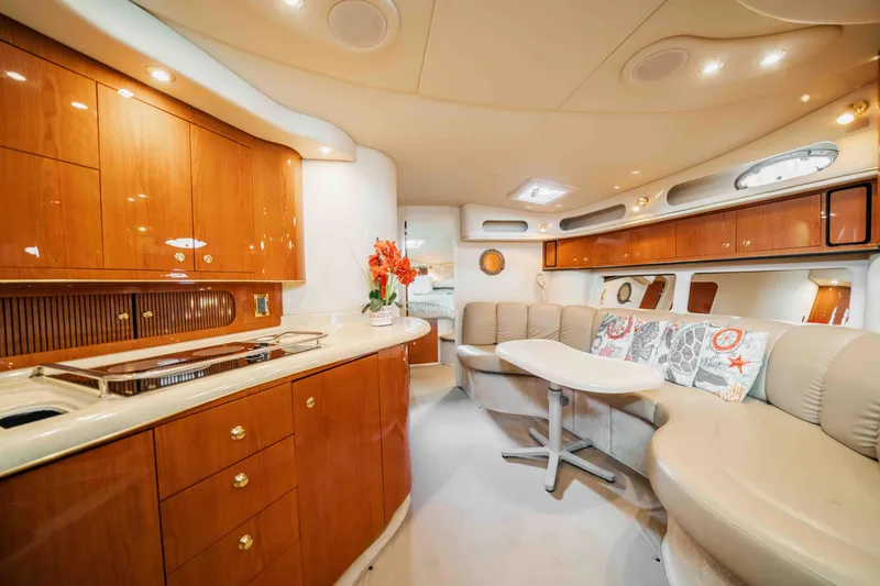 Slide: The Image of Luxurious interior of a 1998 Sea Ray Sundancer 400 yacht with elegant wood cabinetry. - 38